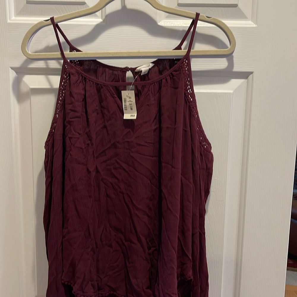 Aeropostale blouse with open shoulder, long sleeves and keyhole back and front.